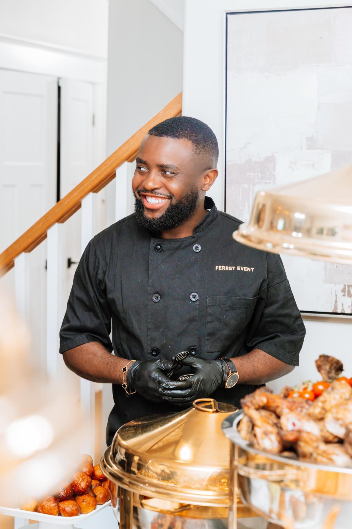 Chef Christmas Ferret preparing a dish during a private event